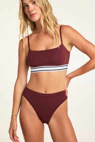 Three-quarter front view of the Cloud Cotton French Cut Brief in Cabernet paired with the Cloud Cotton Bandeau Bralette in Cabernet.