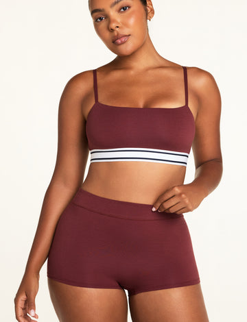 Three-quarter front view of the Cloud Cotton Highwaist Boyshort in Cabernet paired with the Cloud Cotton Bandeau Bralette in Cabernet.