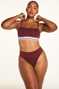 Three-quarter front view of the Cloud Cotton Highwaist Thong in Cabernet paired with the Cloud Cotton Bandeau Bralette in Cabernet.