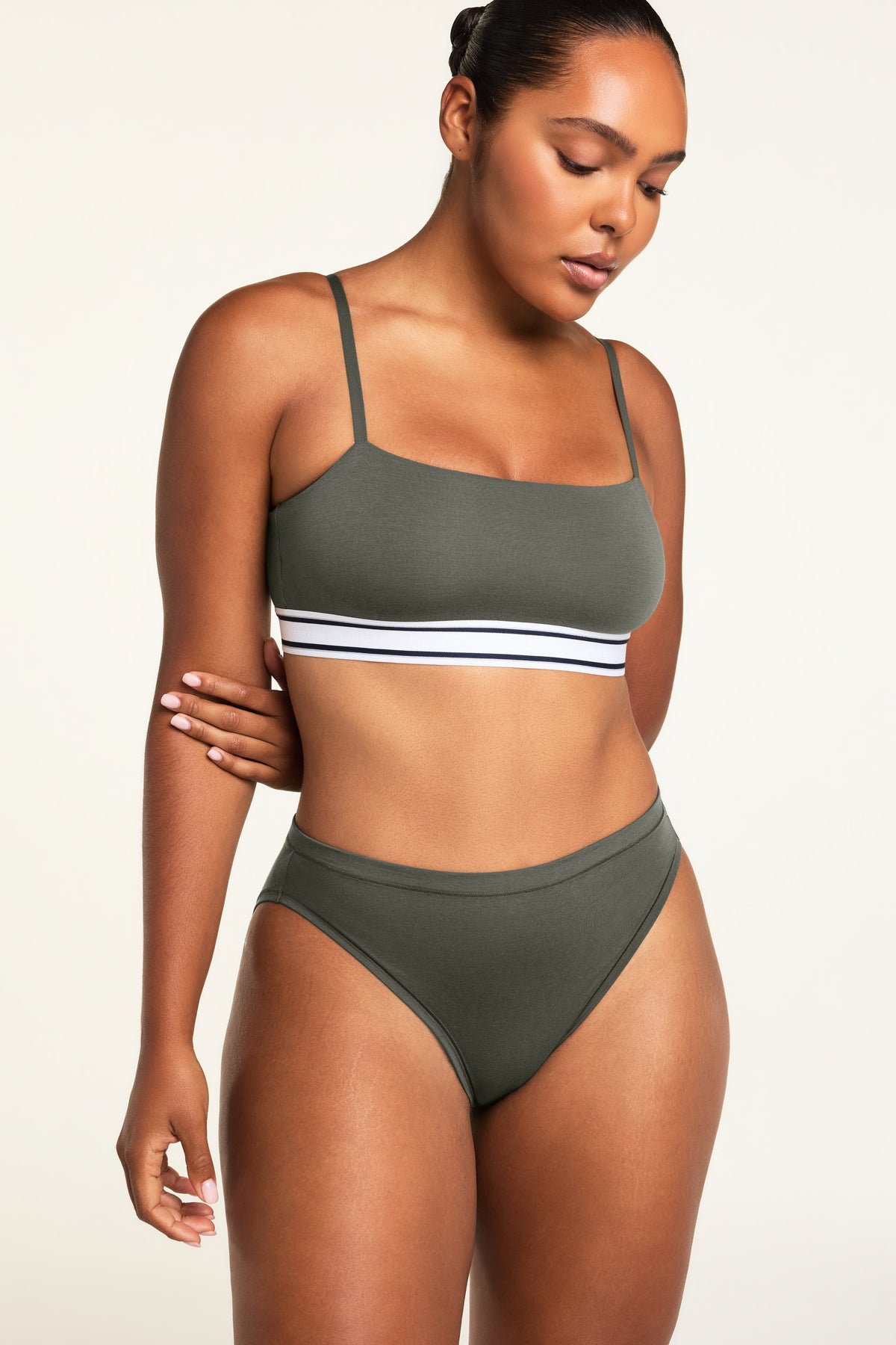 Three-quarter front view of the Cloud Cotton French Cut Brief in Olive paired with the Cloud Cotton Bandeau Bralette in Olive.