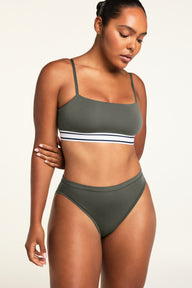 Three-quarter front view of the Cloud Cotton French Cut Brief in Olive paired with the Cloud Cotton Bandeau Bralette in Olive.