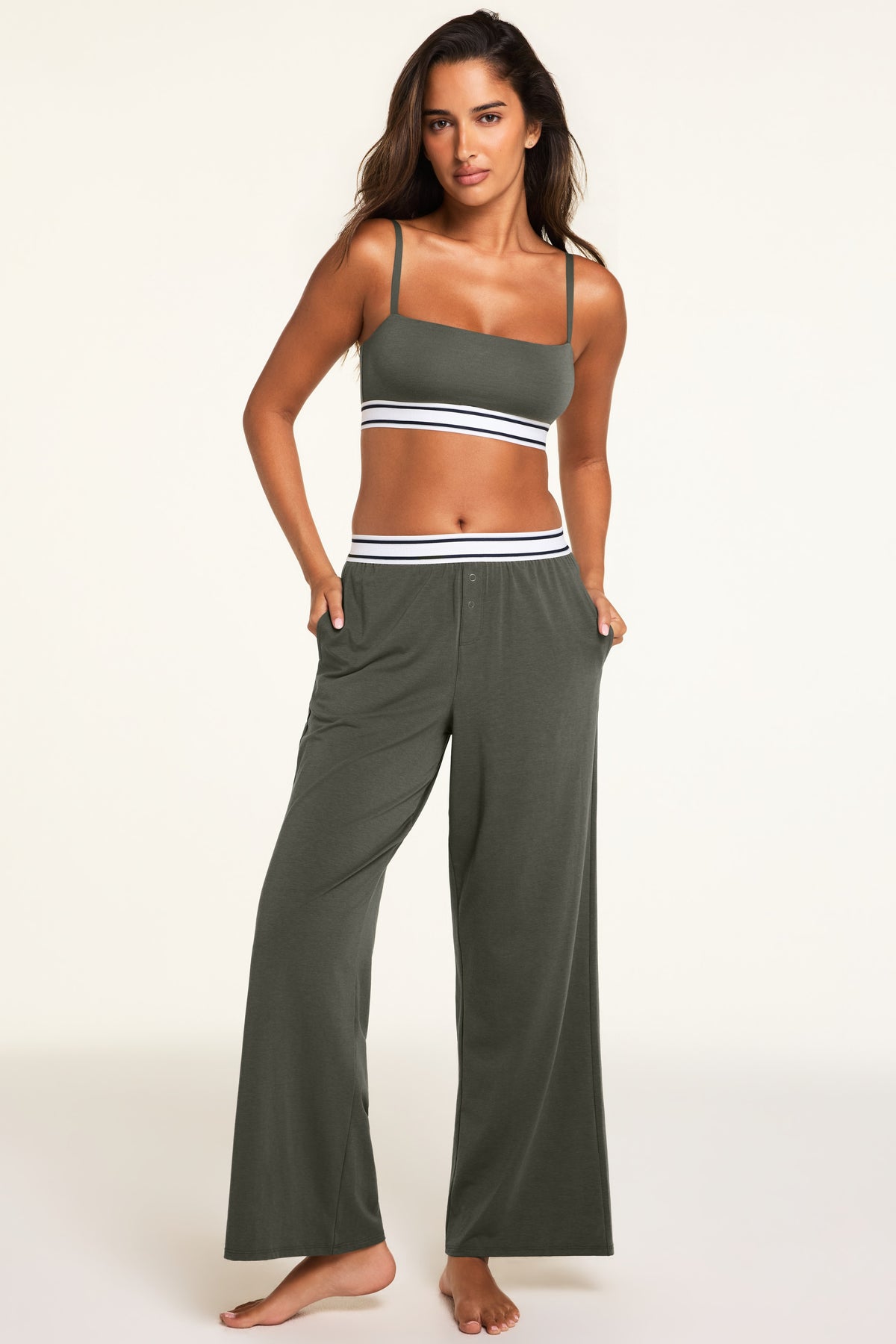 Three-quarter front view of the Cloud Cotton Pant in Olive paired with the Cloud Cotton Bandeau Bralette in Olive.