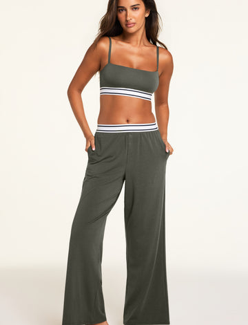 Three-quarter front view of the Cloud Cotton Pant in Olive paired with the Cloud Cotton Bandeau Bralette in Olive.