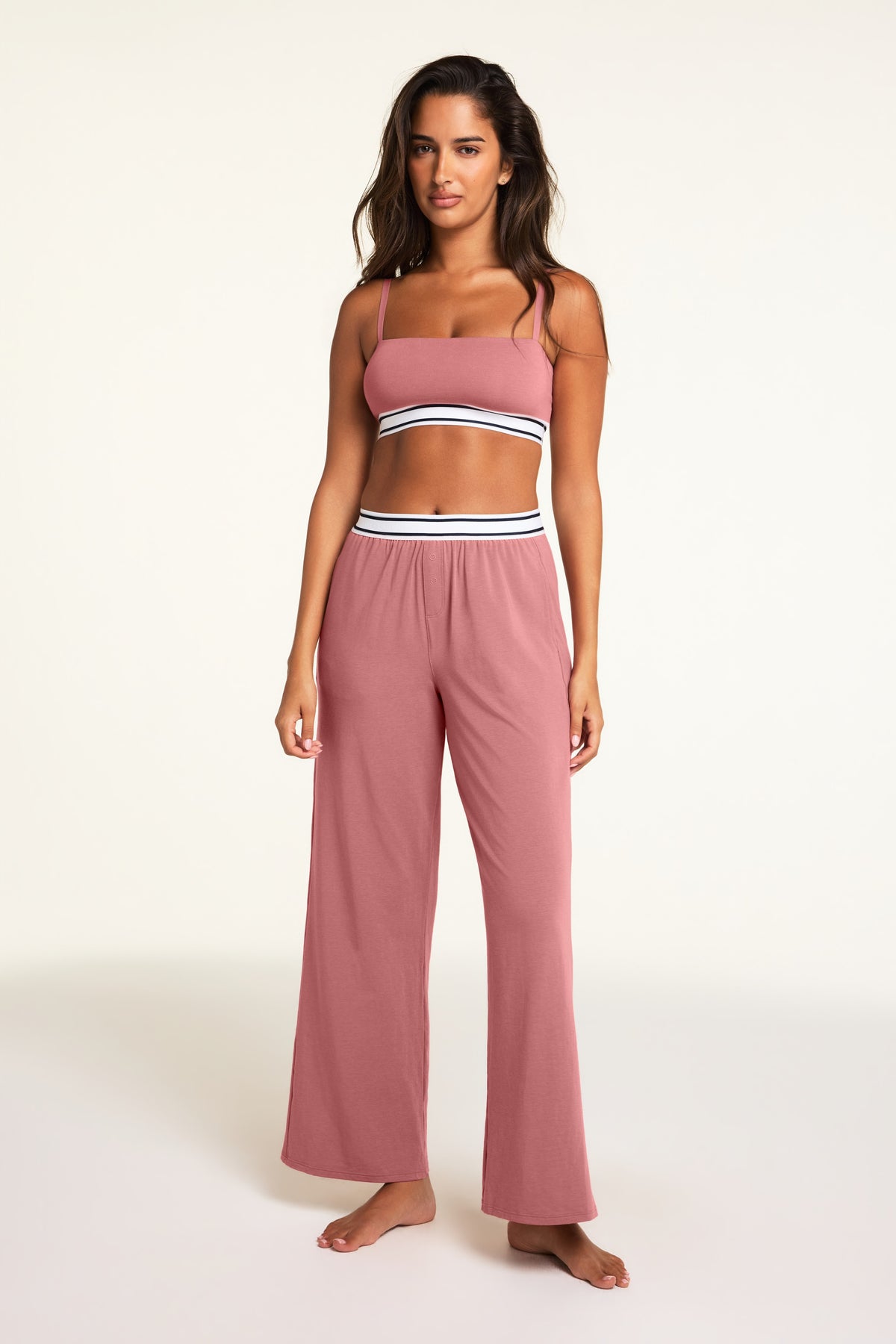 Three-quarter front view of the Cloud Cotton Pant in Winter Rose paired with the Cloud Cotton Bandeau Bralette in Winter Rose.