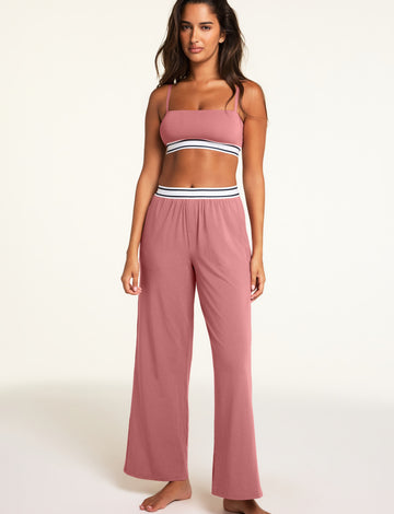 Three-quarter front view of the Cloud Cotton Pant in Winter Rose paired with the Cloud Cotton Bandeau Bralette in Winter Rose.