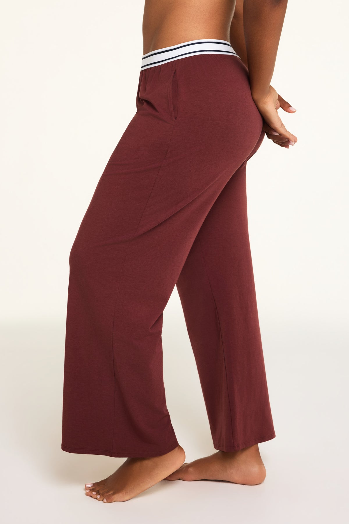 Three-quarter front view of the Cloud Cotton Pant in Cabernet paired with the Cloud Cotton Long Sleeve T-Shirt in Cabernet.