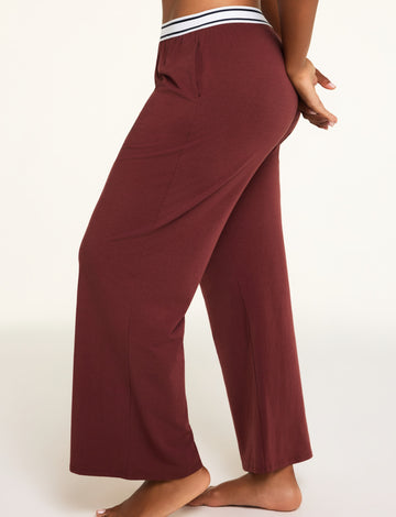 Three-quarter front view of the Cloud Cotton Pant in Cabernet paired with the Cloud Cotton Long Sleeve T-Shirt in Cabernet.