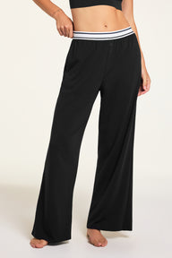 Three-quarter front view of the Cloud Cotton Pant in Black paired with the Cloud Cotton Long Sleeve T-Shirt in Black.