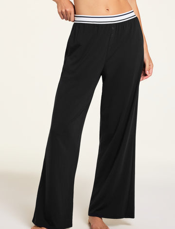 Three-quarter front view of the Cloud Cotton Pant in Black paired with the Cloud Cotton Long Sleeve T-Shirt in Black.