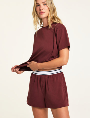 Three-quarter front view of the Cloud Cotton Short in Cabernet paired with the Cloud Cotton T-Shirt in Cabernet.