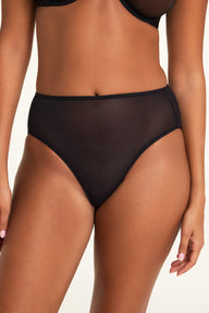Three-quarter front view of the Cloud Cotton Short in Cherry paired with the ComfortMesh™ Plunge Bra in Black.