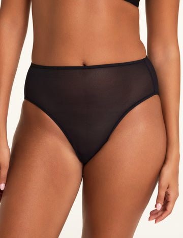 Three-quarter front view of the Cloud Cotton Short in Cherry paired with the ComfortMesh™ Plunge Bra in Black.