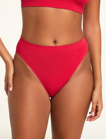 Three-quarter front view of the Knit Seamless French Cut Brief in Cherry paired with the Knit Seamless Bralette in Cherry.