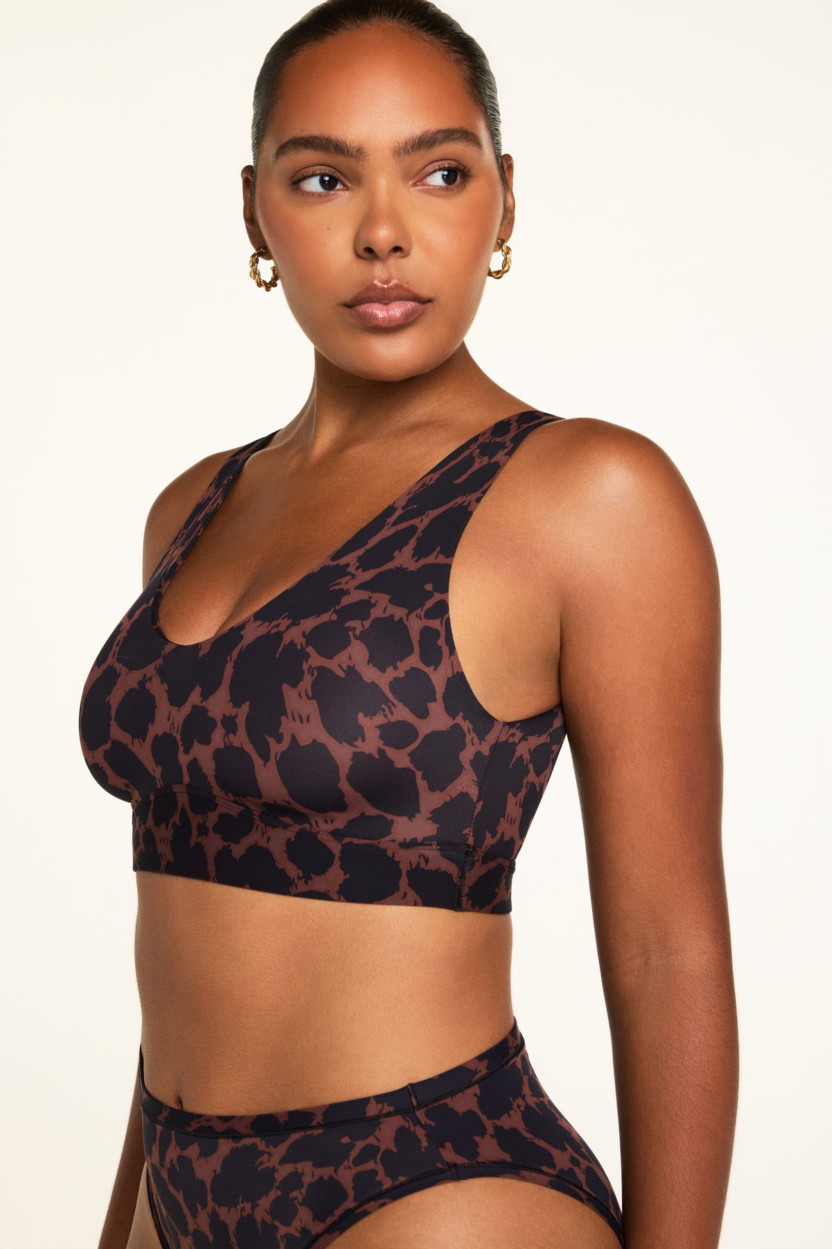 Three-quarter front view of the Bliss Bralette in Leopard paired with the Bliss French Cut Brief in Leopard.