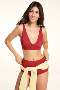 Three-quarter front view of the Bliss Plunge Adjustable Bralette in Ruby paired with the Bliss Boyshort in Ruby.