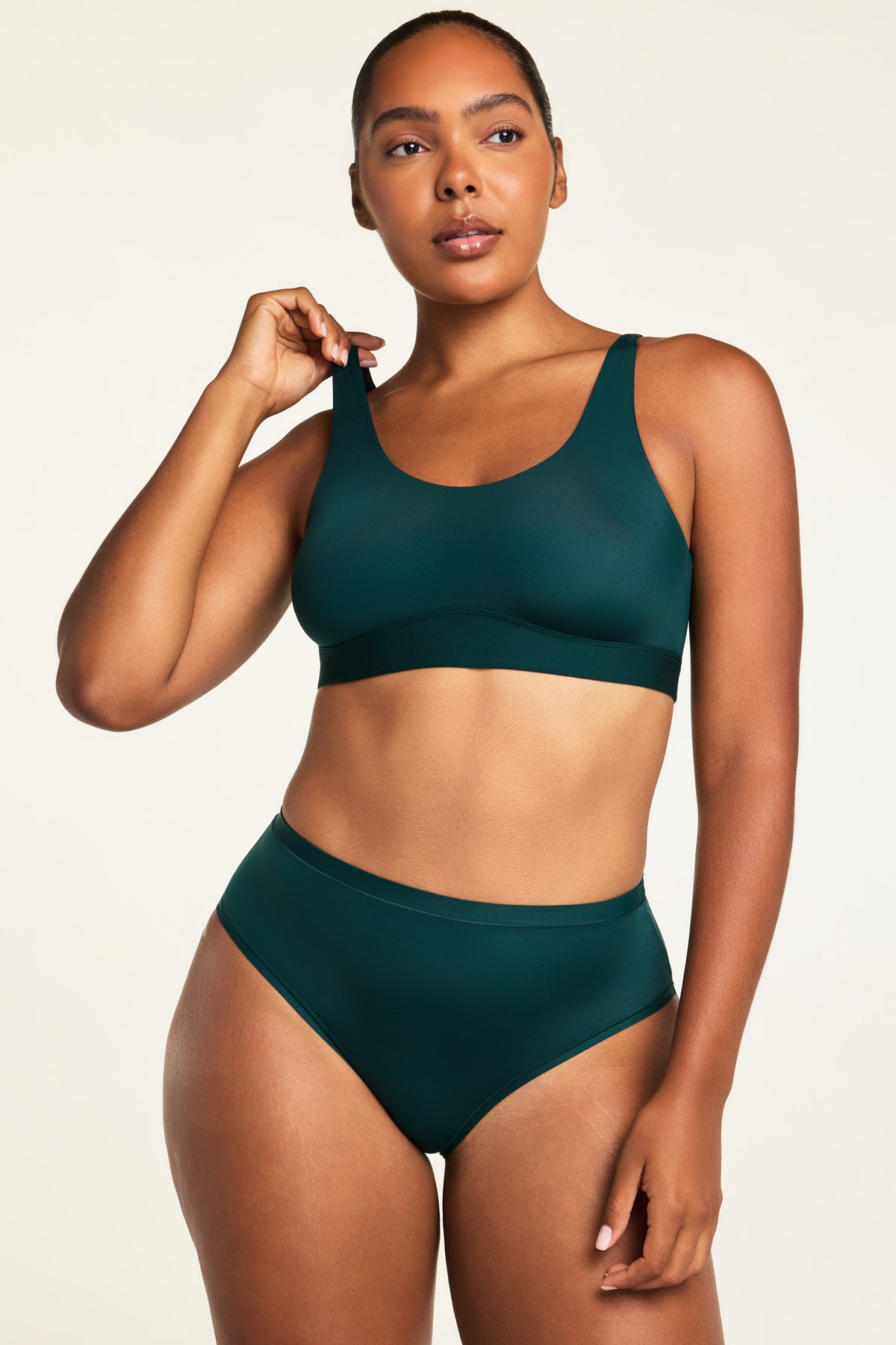 Three-quarter front view of the Bliss Scoop Bralette in Pine paired with the Bliss French Cut Brief in Pine.
