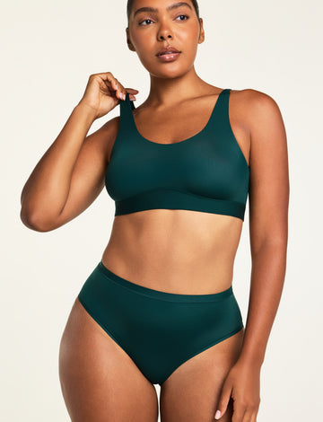 Three-quarter front view of the Bliss Scoop Bralette in Pine paired with the Bliss French Cut Brief in Pine.