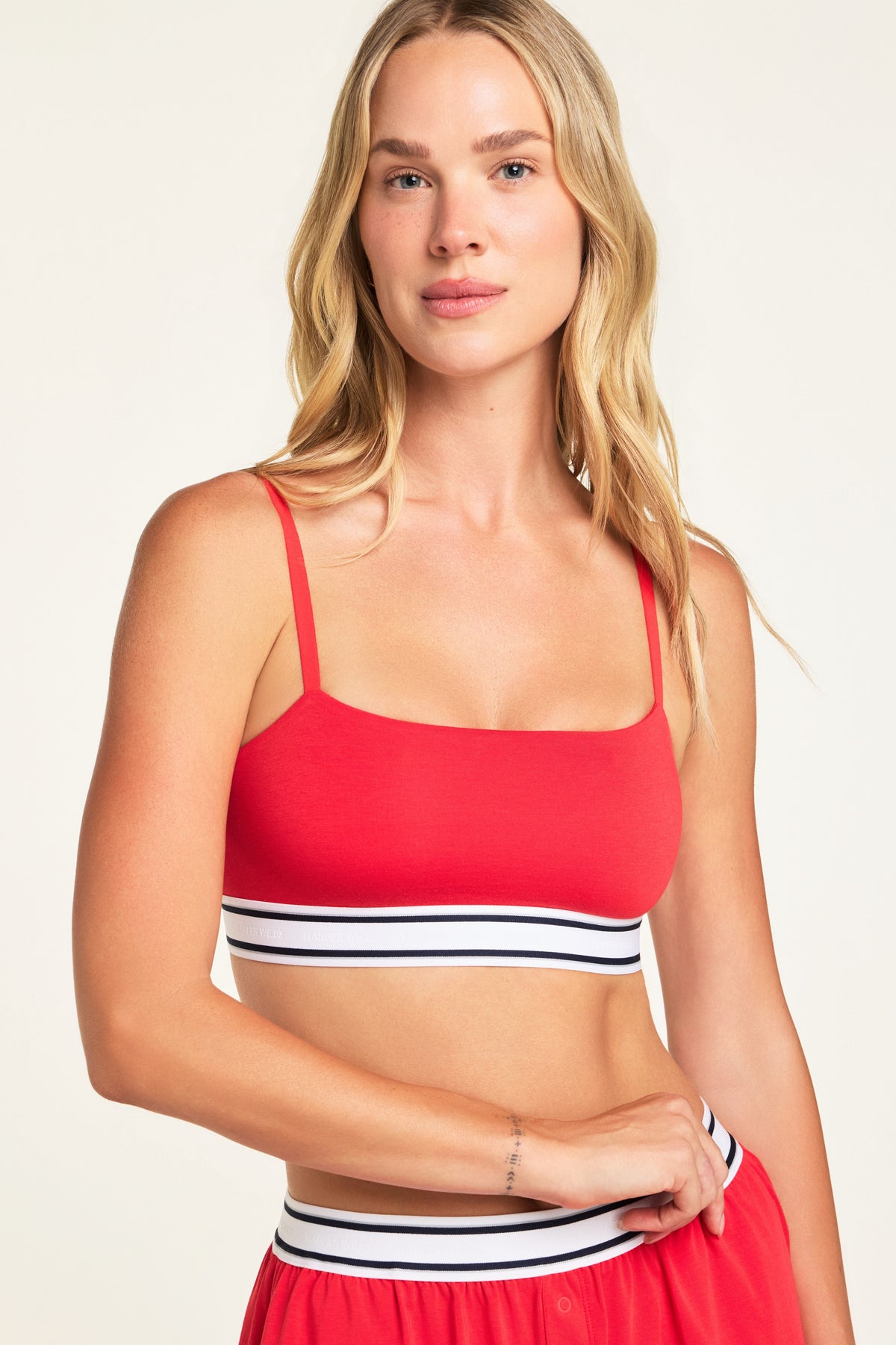 Three-quarter front view of the Cloud Cotton Bandeau Bralette in Cherry paired with the Cloud Cotton Short in Cherry.