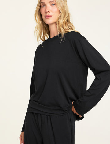 Three-quarter front view of the Cloud Cotton Long Sleeve T-Shirt in Black paired with the Cloud Cotton Pant in Black.