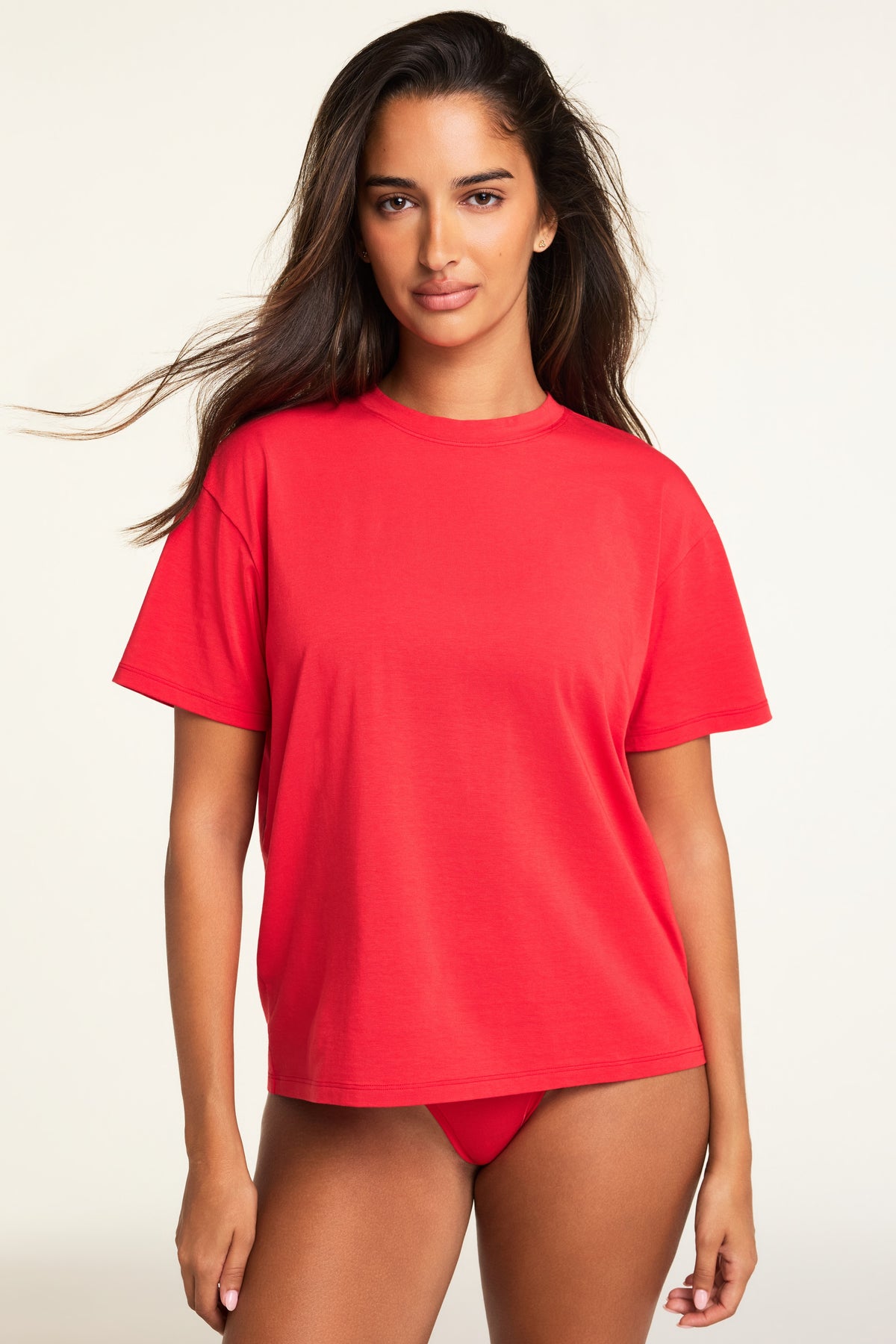 Three-quarter front view of the Cloud Cotton T-Shirt in Cherry paired with the Cloud Cotton Highwaist Thong in Cherry.