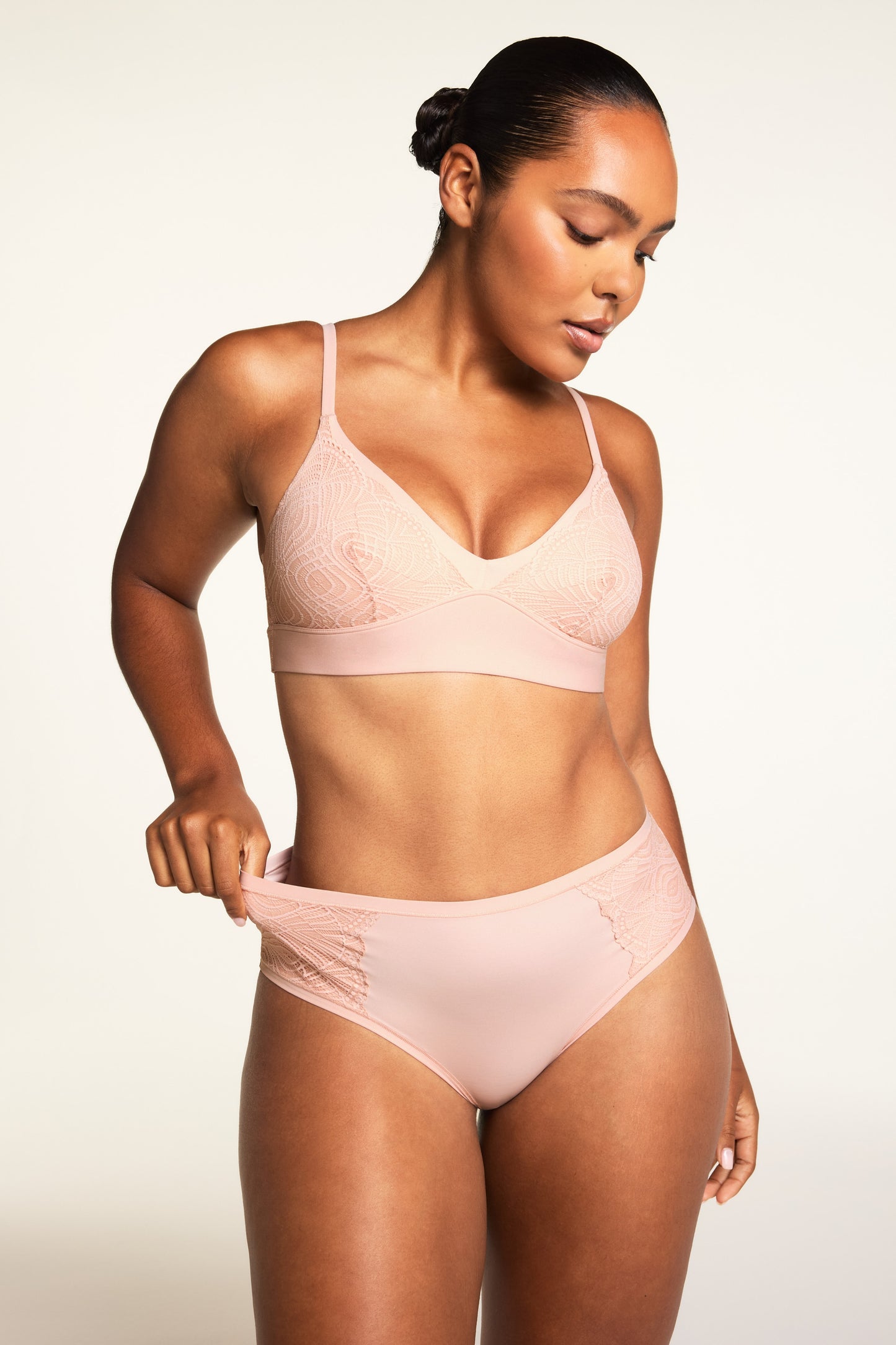 Three-quarter front view of the Bliss Lace Highwaist Brief in Ember Rose, showing the lace side panel and high-rise silhouette