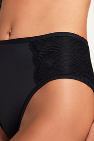 Close-up of the Bliss Lace Highwaist Brief in Black on Holly, highlighting the soft lace trim and smooth microfiber front.