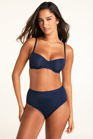Three-quarter front view of the Base Balconette in Navy, highlighting the thin adjustable straps and balconette cup construction