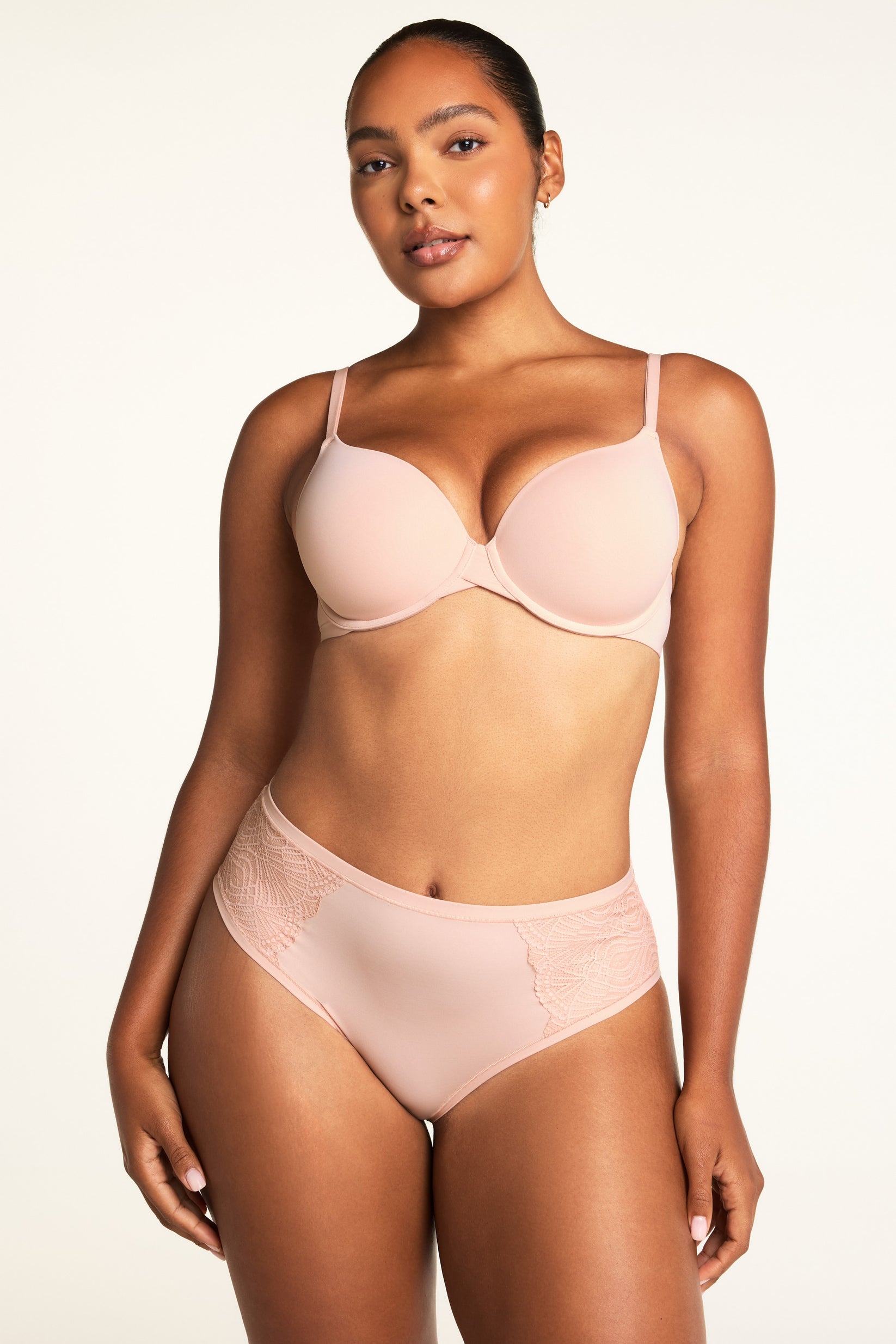 Three-quarter front view of the Base T-Shirt Bra in Ember Rose, highlighting the thin adjustable straps and smooth molded cup construction
