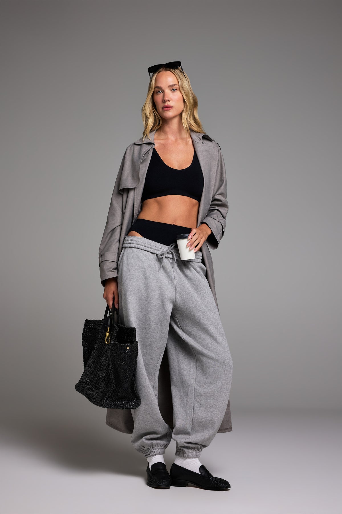 Editorial on-model shot of the Knit Seamless Bralette in Black styled with the Knit Seamless French Cut Brief in Black.
