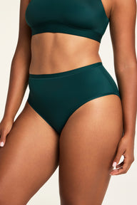 Back on-model view of the Bliss French Cut Brief in Pine paired with the Bliss Scoop Bralette in Pine.