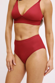 Three-quarter front view of the Bliss Highwaist Brief in Ruby paired with the Bliss Triangle Bralette in Ruby.