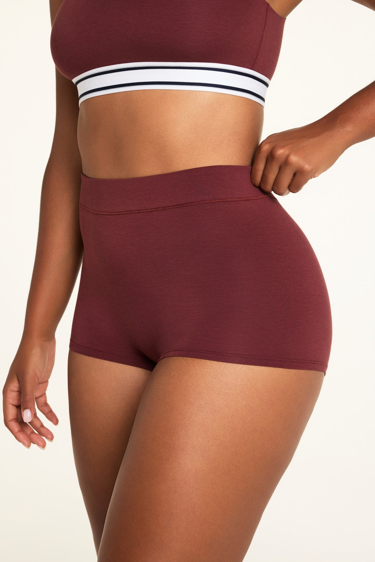 Back on-model view of the Cloud Cotton Highwaist Boyshort in Cabernet paired with the Cloud Cotton Bandeau Bralette in Cabernet.