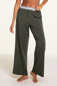 Back on-model view of the Cloud Cotton Pant in Olive paired with the Cloud Cotton Bandeau Bralette in Olive.