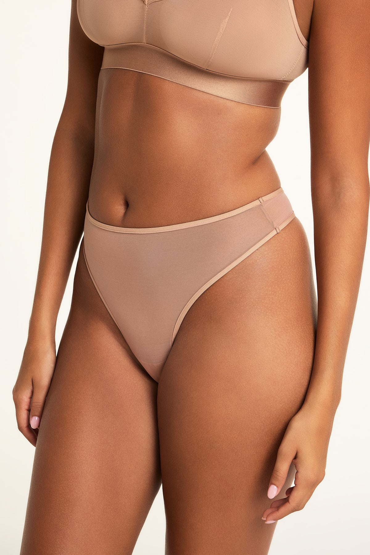 Back on-model view of the ComfortMesh™ Thong in Taupe paired with the ComfortMesh™ Triangle Bralette in Taupe.