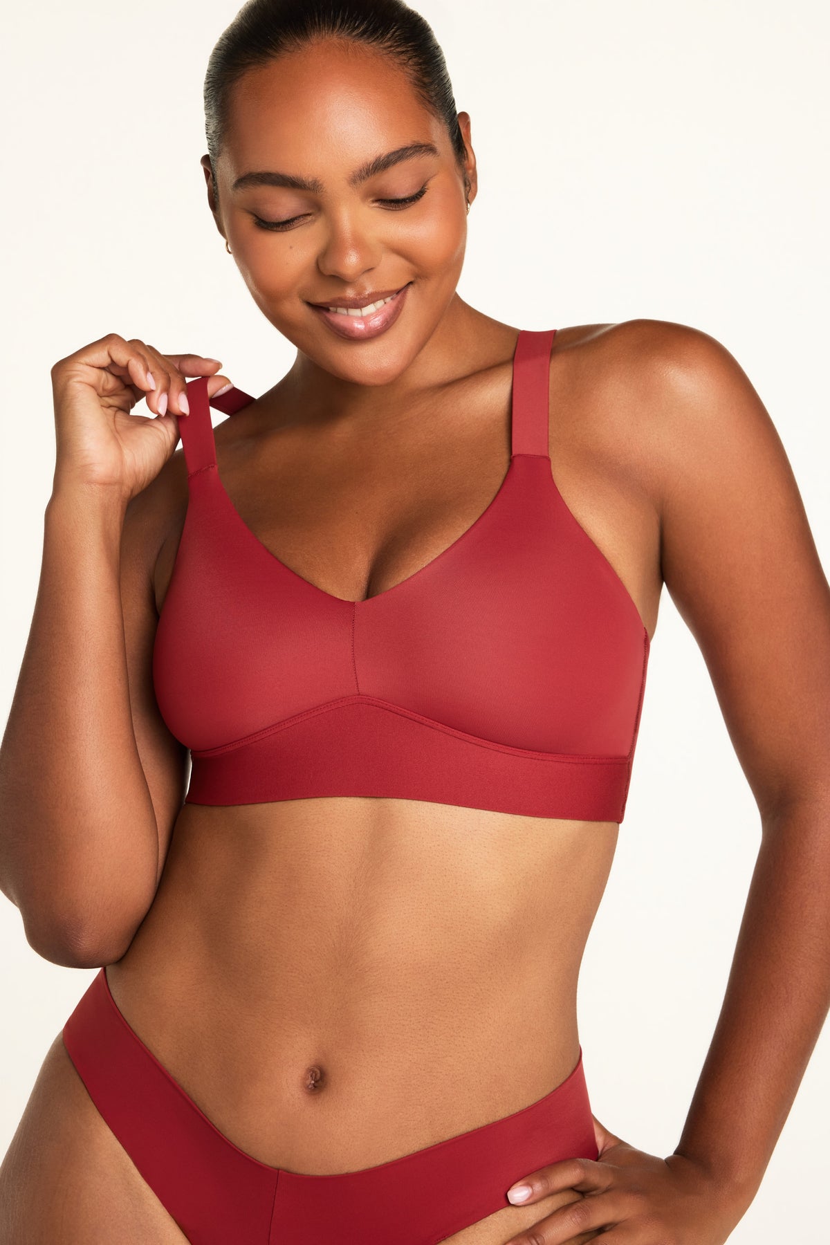 Back on-model view of the BlissSmooth Bralette in Ruby paired with the Bliss Low Rise Bikini in Ruby.