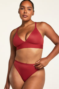 Back on-model view of the Bliss Triangle Bralette in Ruby paired with the Bliss Thong in Ruby.