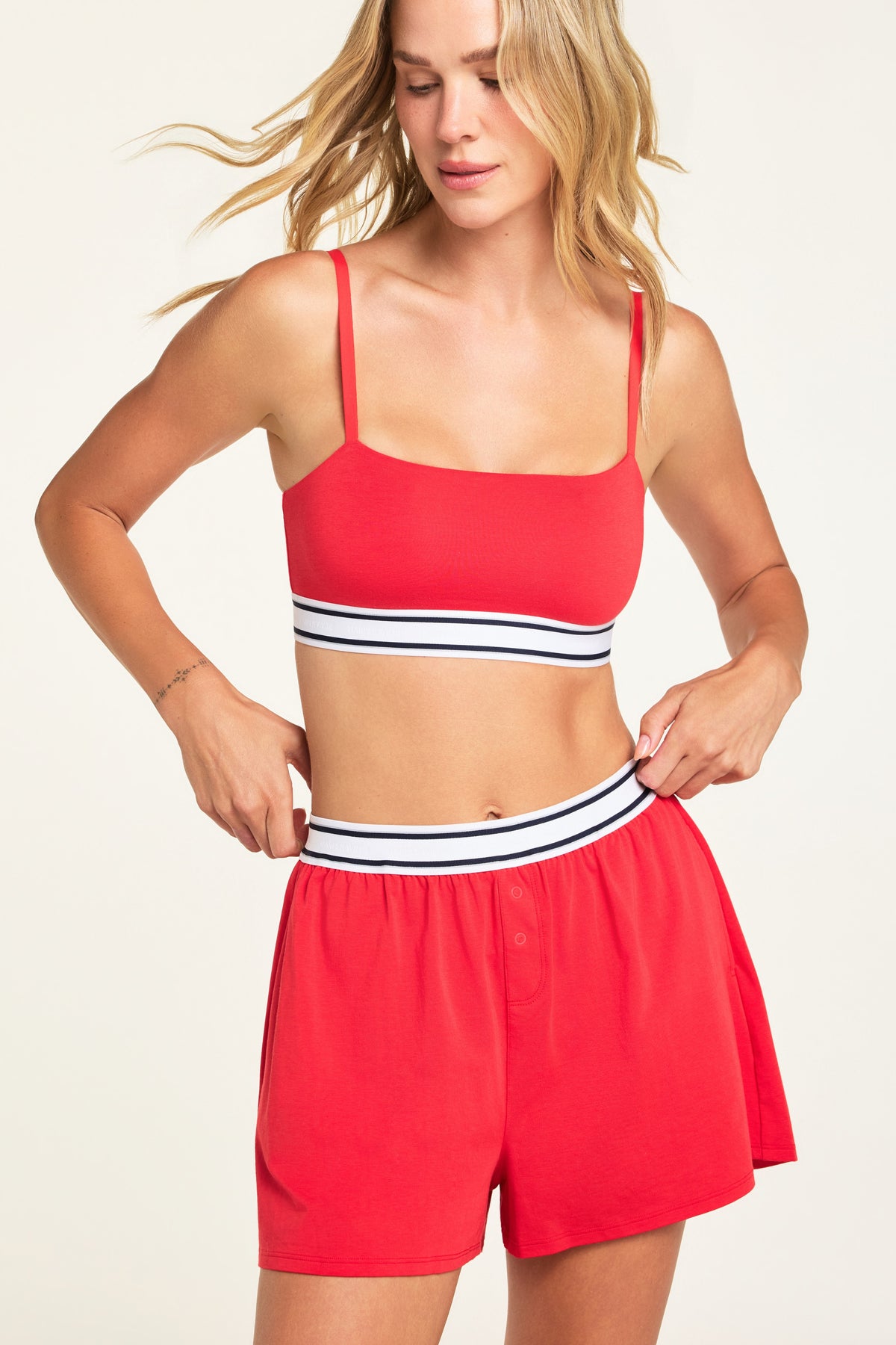 Back on-model view of the Cloud Cotton Bandeau Bralette in Cherry paired with the Cloud Cotton Short in Cherry.