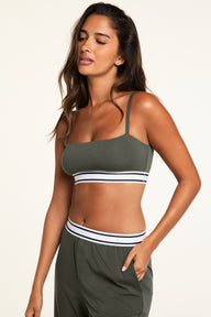 Back on-model view of the Cloud Cotton Bandeau Bralette in Olive paired with the Cloud Cotton Pant in Olive.
