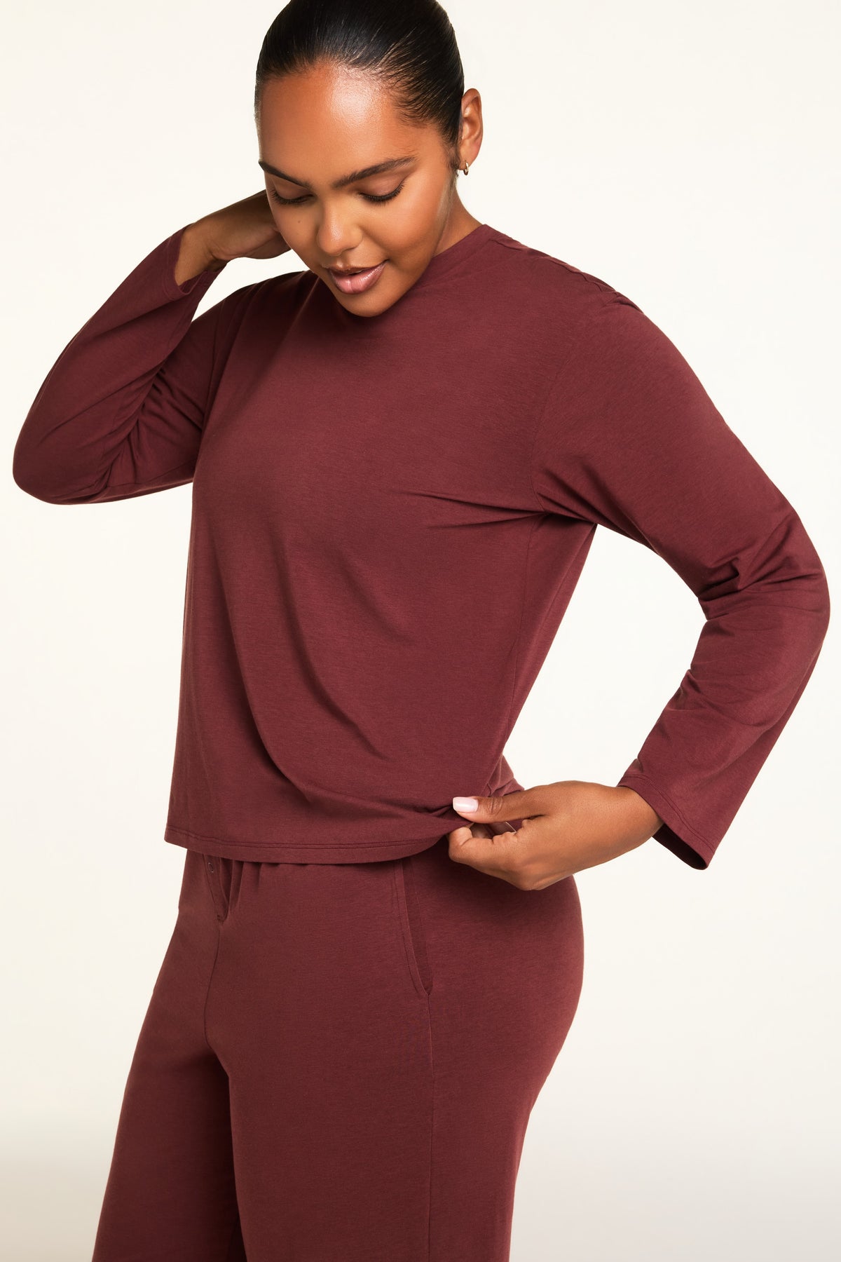 Back on-model view of the Cloud Cotton Long Sleeve T-Shirt in Cabernet paired with the Cloud Cotton Pant in Cabernet.