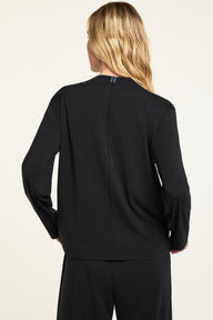 Back on-model view of the Cloud Cotton Long Sleeve T-Shirt in Black paired with the Cloud Cotton Pant in Black.