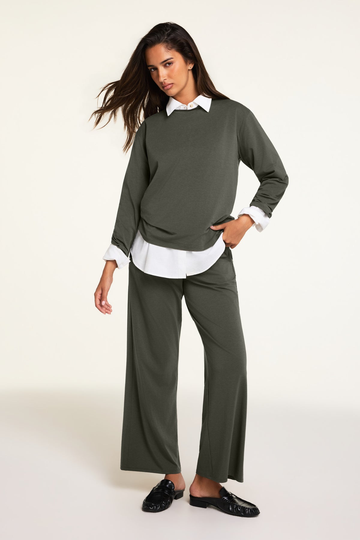 On-model product shot of the Cloud Cotton Long Sleeve T-Shirt in Olive paired with the Cloud Cotton Pant in Olive.