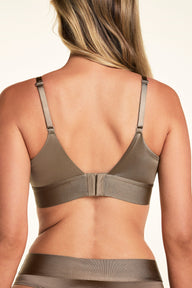 On a white studio backdrop, a Meagan wears the Stretch Satin Triangle Bralette in Champagne, shown from the back with adjustable straps, a wide wireless band, and a hook-and-eye closure. The matching highwaist thong is also visible.