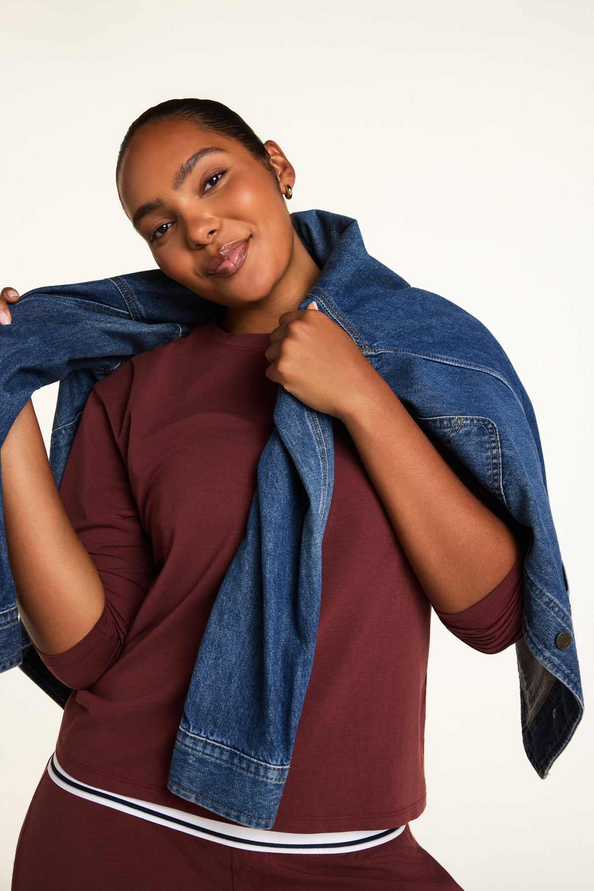 Editorial on-model shot of the Cloud Cotton Long Sleeve T-Shirt in Cabernet styled with the Cloud Cotton Pant in Cabernet.