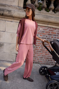 Lifestyle on-model shot of the Cloud Cotton Long Sleeve T-Shirt in Winter Rose paired with the Cloud Cotton Pant in Winter Rose.