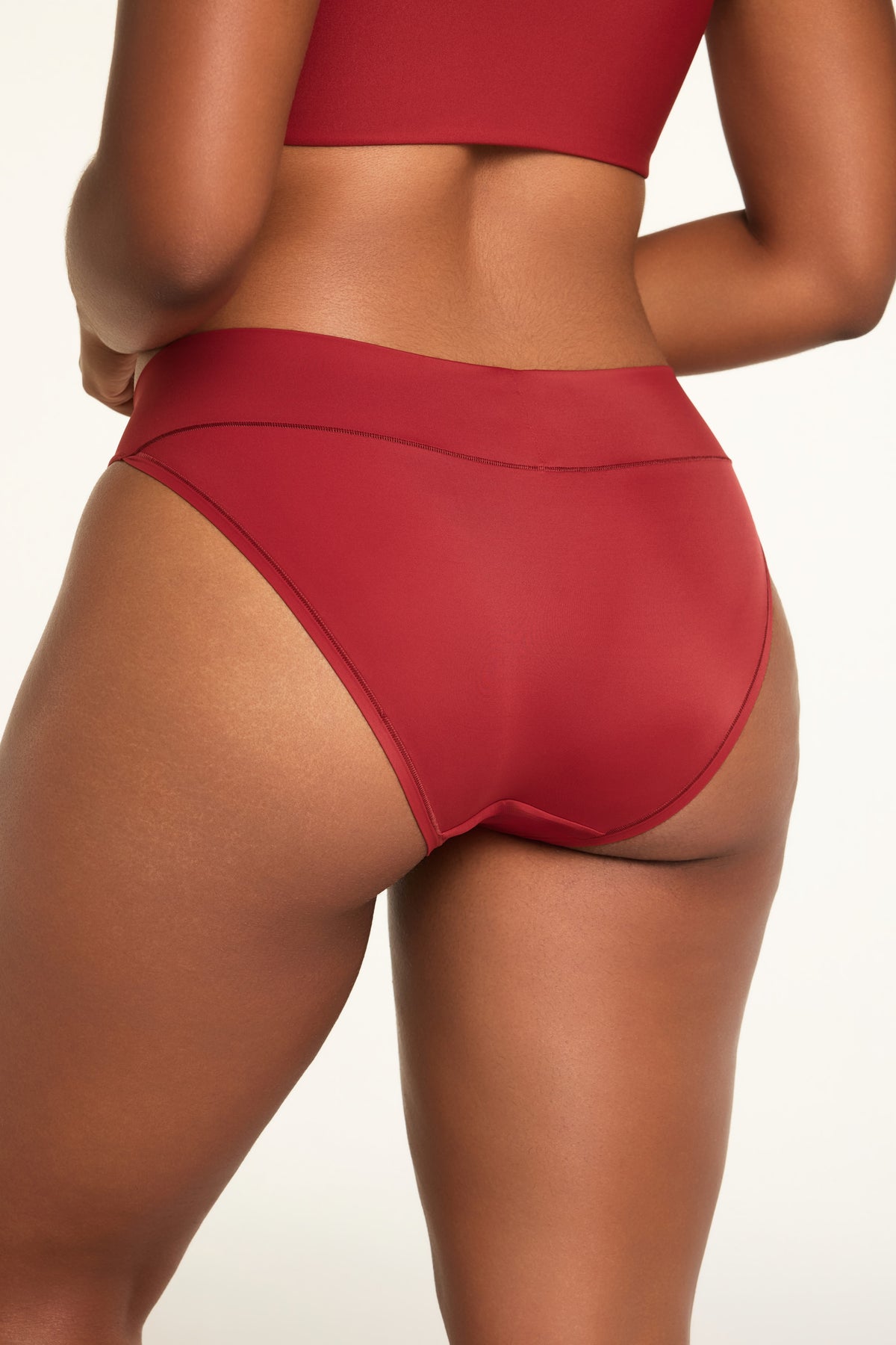 Close-up front view of the Bliss Low Rise Bikini in Ruby paired with the BlissSmooth Bralette in Ruby.