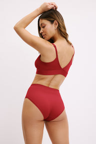 Three-quarter back view of the Bliss Highwaist Brief in Ruby paired with the Bliss Triangle Bralette in Ruby.