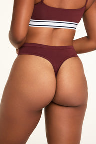 Close-up front view of the Cloud Cotton Highwaist Thong in Cabernet paired with the Cloud Cotton Bandeau Bralette in Cabernet.