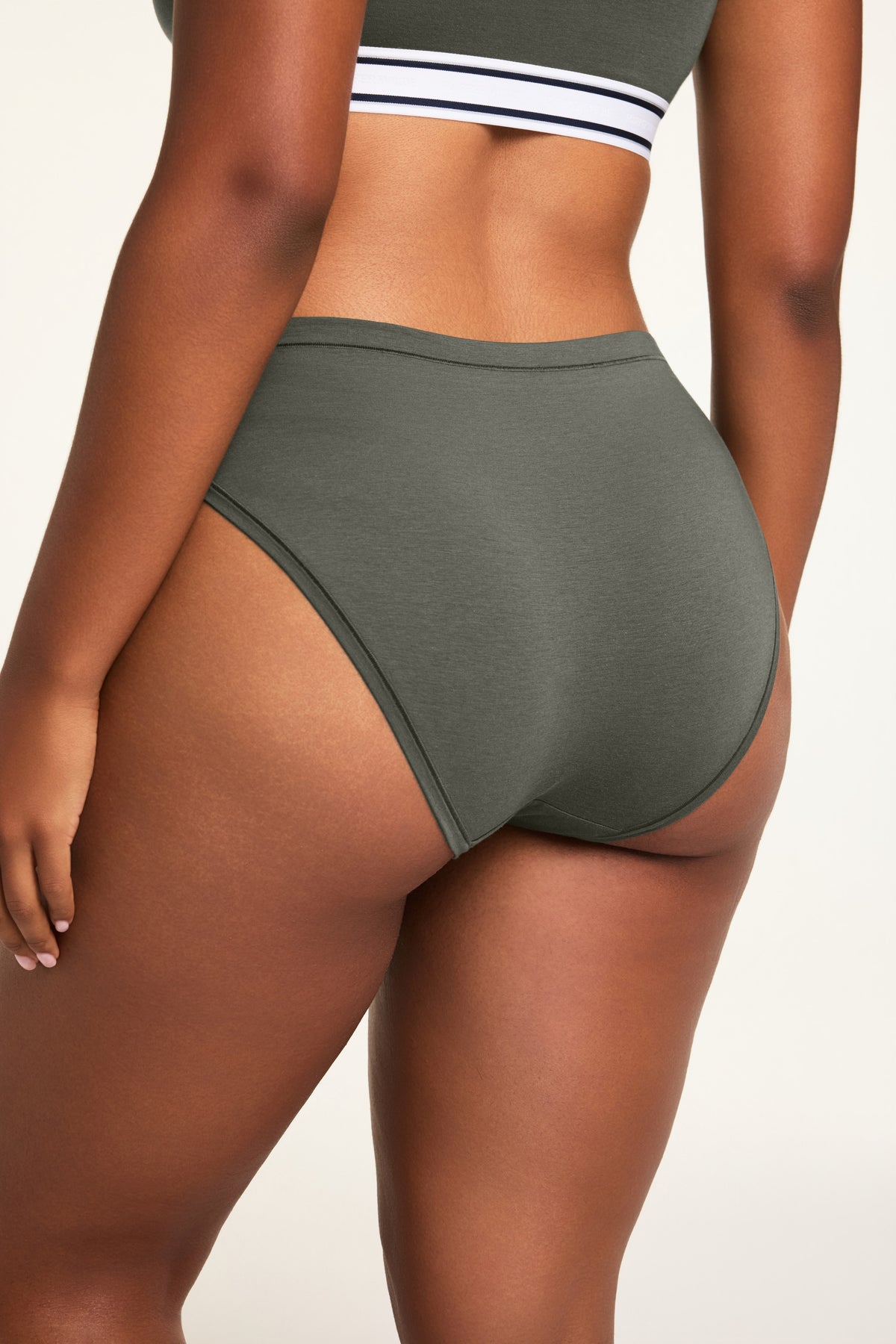 Close-up front view of the Cloud Cotton French Cut Brief in Olive paired with the Cloud Cotton Bandeau Bralette in Olive.