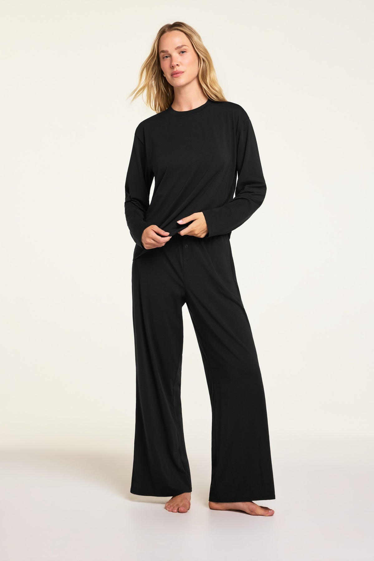 Close-up front view of the Cloud Cotton Pant in Black paired with the Cloud Cotton Long Sleeve T-Shirt in Black.