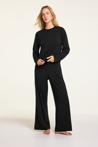 Close-up front view of the Cloud Cotton Pant in Black paired with the Cloud Cotton Long Sleeve T-Shirt in Black.